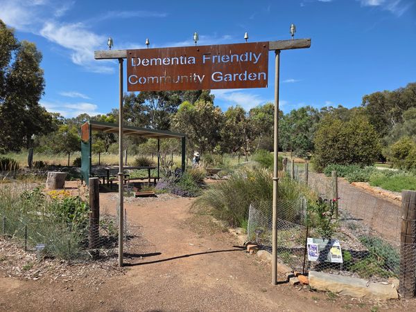 Entrance to a Dementia Friendly Community Garden on a sunny day.
