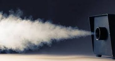 A device emitting a thick white smoke or vapor into the air.
