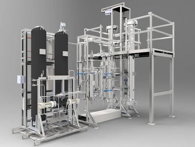 A supercritical carbon dioxide extraction device is shown with its bright stainless steel vessels at