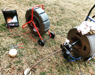 Snaking a main sewer line that was clogged.