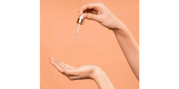 Female hand over colored background