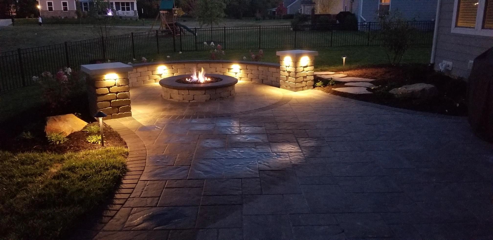 Paver patio with built in seating & lighting, and gas brick fireplace
