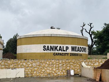 A large water tank labeled Sankalp Meadows with 250000 liters capacity.
24/7 water supply infrastructure at na plot project in third mumbai
mumbai third properties
sankalp meadows
riyasat infra
riyasat