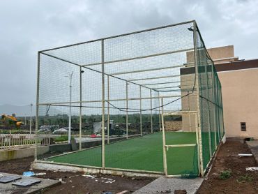 Outdoor cricket practice net enclosure on a cloudy day.
turf box cricket court amenity at residential na plots in third mumbai
mumbai third properties
sankalp meadows
riyasat infra
riyasat