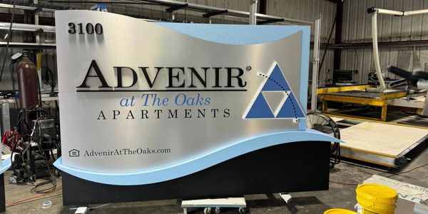 A monument sign being manufactured in a shop waiting to be delivered