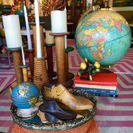 vintage textile, vintage globe, living room, tablescape, table vignette, vintage mirror tray, vintage globes, vintage wooden shoe forms, vintage books, mid century jacks, candles