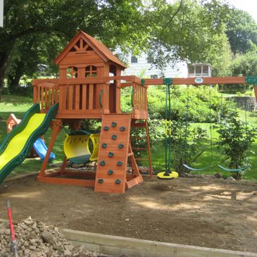 A picture of fort design swing set and slider