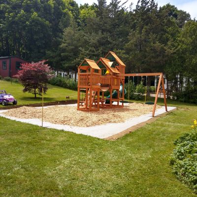 A picture of the swing set installed under IAW  ASTM, CPSC guidelines
