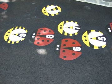 Ladybug Hopscotch painted graphics made from preformed Thermoplastic by Surface Signs of NY
