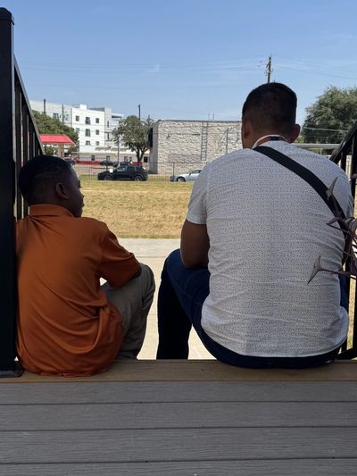 Carlos Velasco connecting with a student.