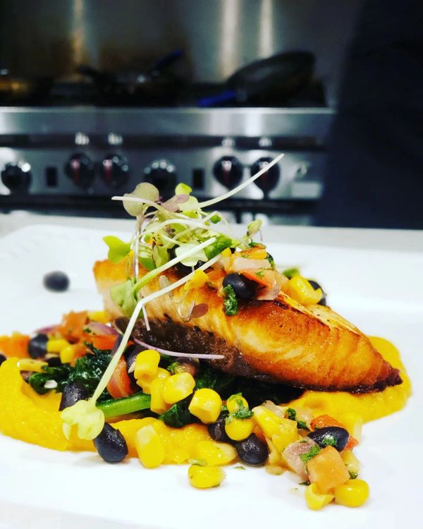 Clarendon Cuisine's Seared Salmon Sweet Potato Puree Sautéed Spinach & Sweet Corn Succotash