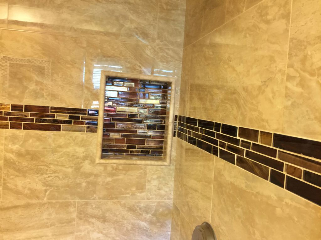 Beige and bronze tile in shower
