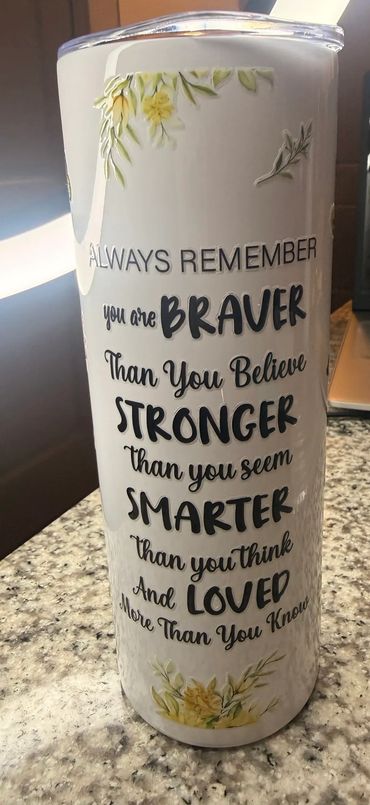 White tumbler with an inspirational quote and floral design.