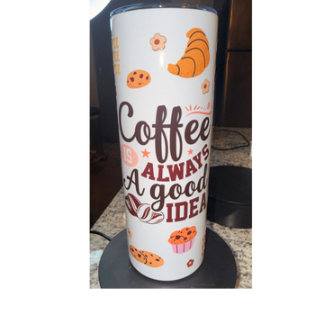 White coffee tumbler with a motivational coffee quote and pastry illustrations.