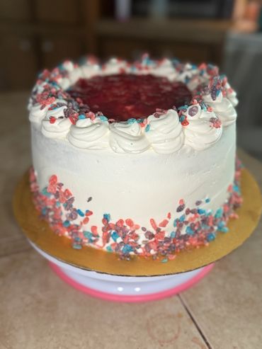 Raspberry filling topped with raspberry jam and fruity pebbles!