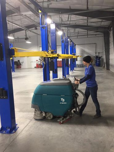 woman cleaning concrete floor