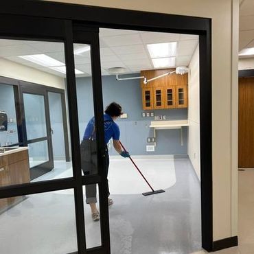 girl mopping floor