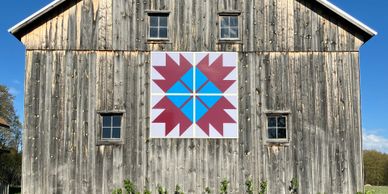 Quilt Block on Pioneer Barn at Marilla Museum and Pioneer Place - Maple Leaf quilt design.