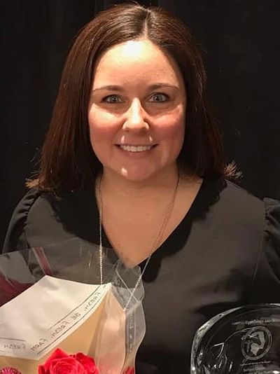 Tina M. Rocco M.A. CCC-SLP receiving American Hippotherapy Association Therapist of the year award