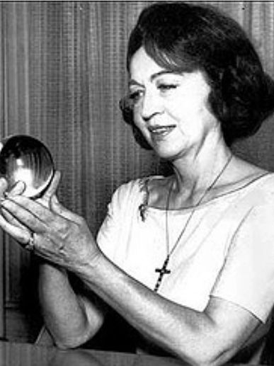 Jeane Dixon holding a crystal ball