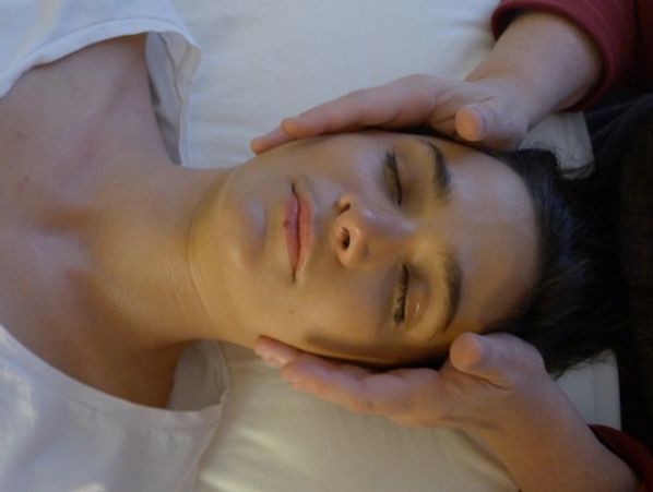 Woman receiving gentle TMJ massage at Wholly Spirt Hands in Sugar Land, TX.