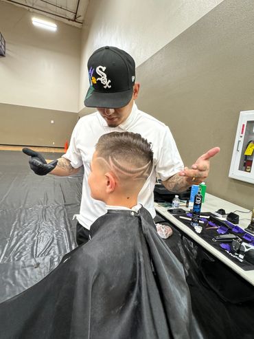 Celebrity Stylist Monster Eddie donating his time for the community.