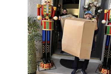 Director Richard Morales loading up the truck with clothes