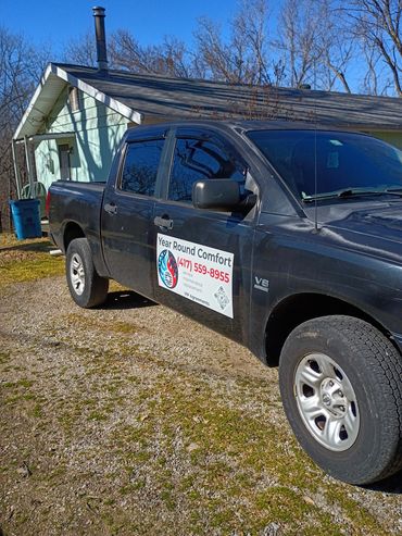 year round comfort truck magnets on a black service truck.