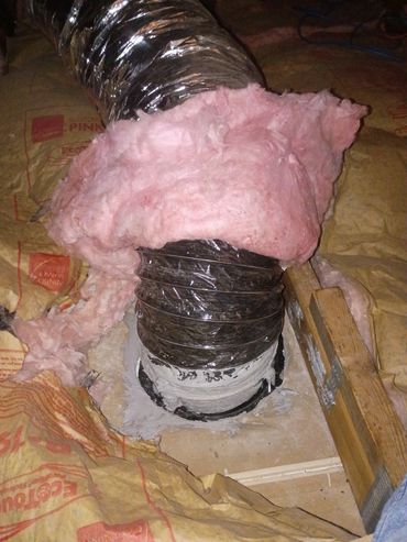 Ductwork wrapped in insulation with pink fiberglass around a vent pipe.
Hartville,MO