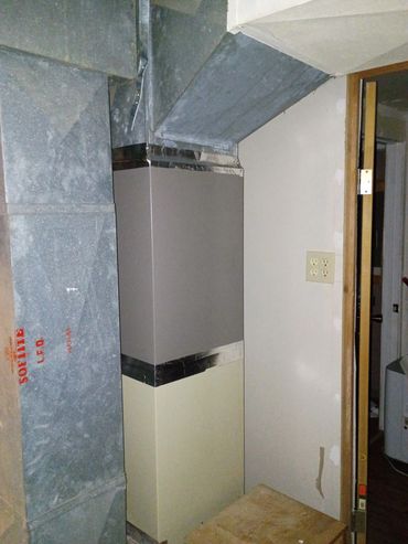 Metal HVAC ducts and a junction box in a utility room corner.
Reeds Spring, MO