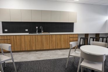 Tea prep joinery unit in breakout space in education facility.