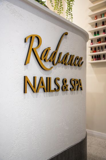 Retail gold 3D lettering placed on white rendered point of sale.