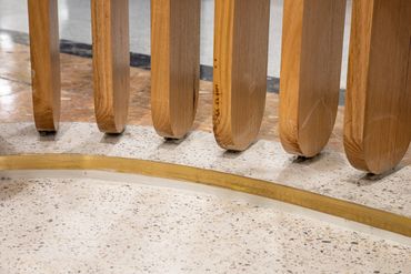 Shopfront design detail exhibiting curved timber battens.