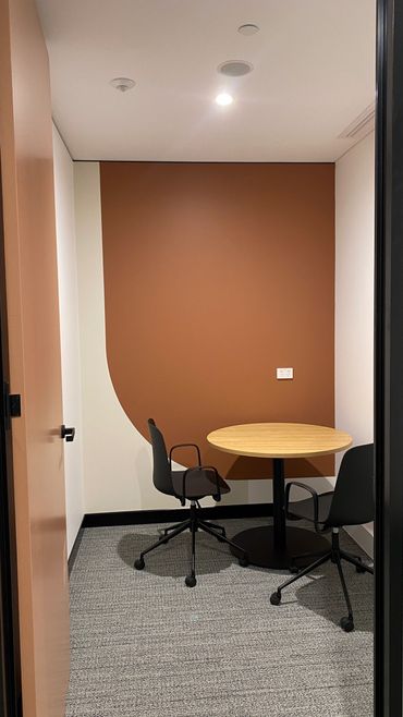 Focus rooms within office space showcasing feature paint.