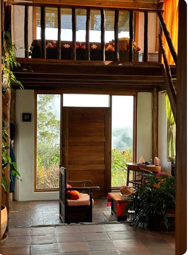 Cozy wooden interior with natural light and rustic furniture.