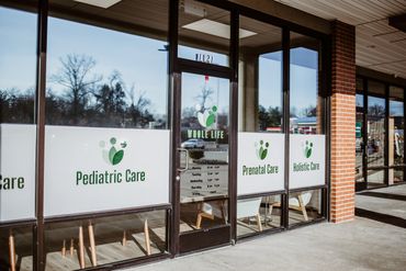 Exterior of a healthcare clinic offering pediatric, prenatal, and holistic care.