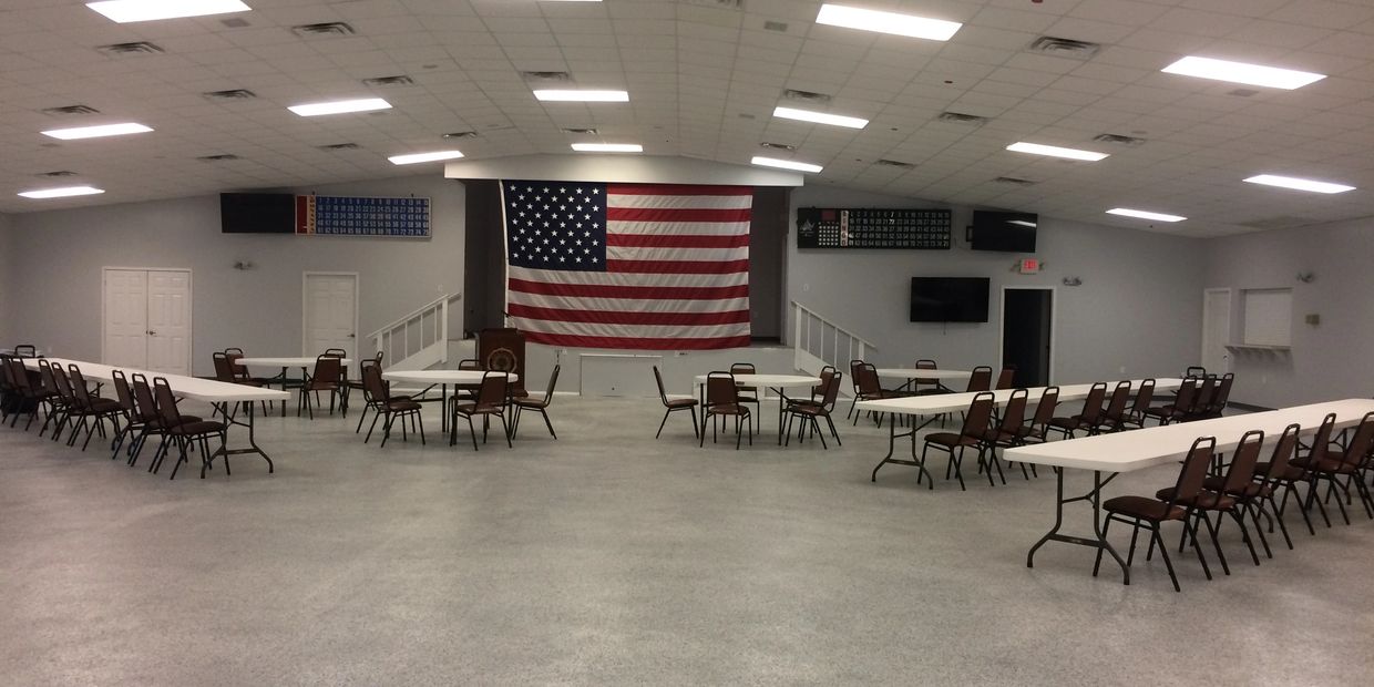 Main Hall view of American Flag covering stage.