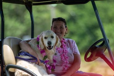 co-owner Sherry Landers and Sailor our golden dock diving dog