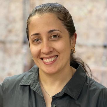 Staff member smiling for a picture while at Gentog Senior Daycare in Tigard, Oregon