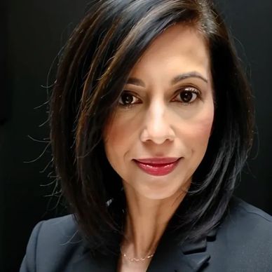 Professional woman with dark hair and blazer.