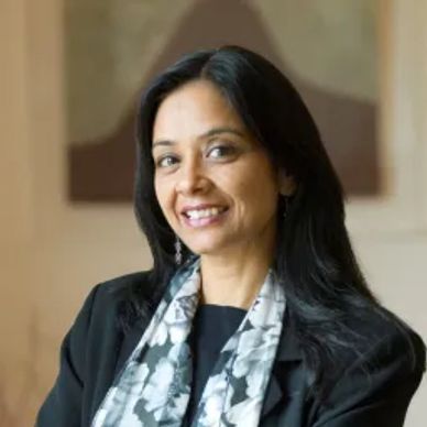 Portrait of a smiling woman with long black hair.
