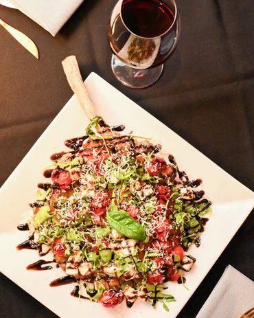 Mangia E Bevi bone-in pork chop Milanese with balsamic glaze in Massapequa Park