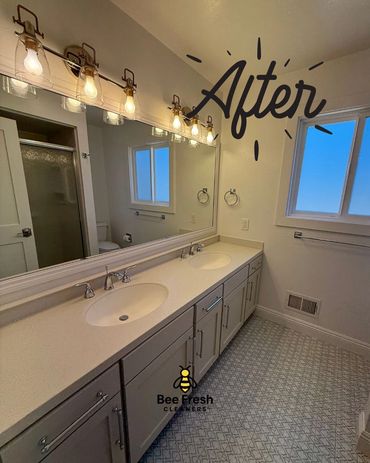 A pristine Walnut Creek bathroom with dual sinks, clean tile floors, and sanitized cabinets.