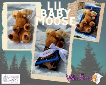 Plush moose swaddled in quilt.