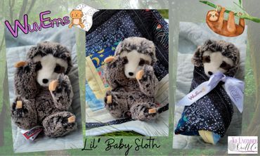 Plush sloth wrapped in quilt.