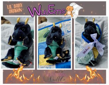 Plush navy dragon wrapped in quilt.