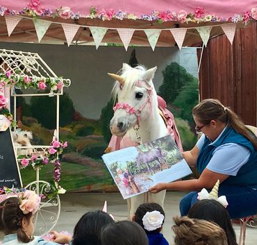 Reading to a real live unicorn for Storytime