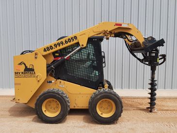 Cat skid steer with auger or fork attachments, hydraulic, bobcat, buckets, concrete saw, tools