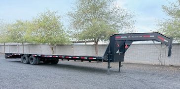 Gooseneck trailer for heavy hauling, cell license required. Mega ramps, long trailer, chains straps
