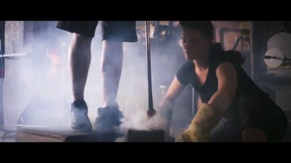 handmade, mouth blown glass is dropped into a wooden mold.